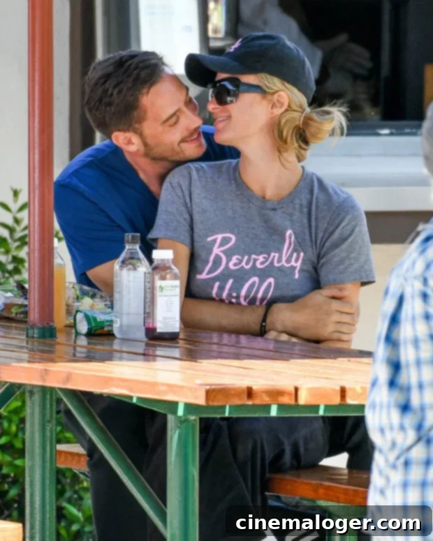 Paris Hilton Debuts 'P'-Engraved Emerald Cut Diamond Engagement Ring 3 Paris Hilton and Carter Reum