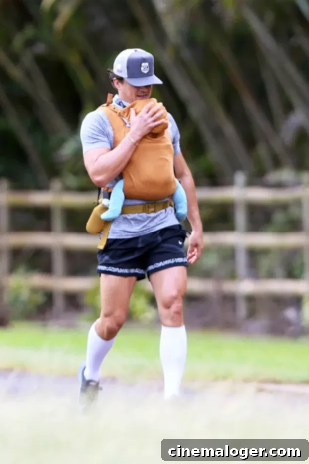 Mom Life In Hawaii: Katy Perry Cradles 6-Month-Old Daisy In Swimsuit 3 Orlando Bloom carrying Daisy Dove in a papoose.