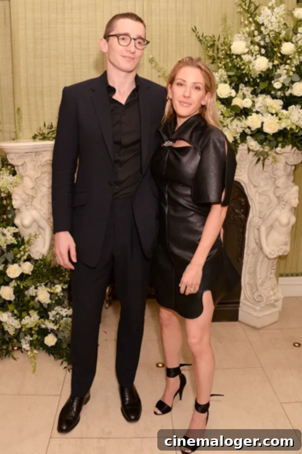 Ellie Goulding and Caspar Jopling, elegant in wedding attire, embracing on their wedding day.