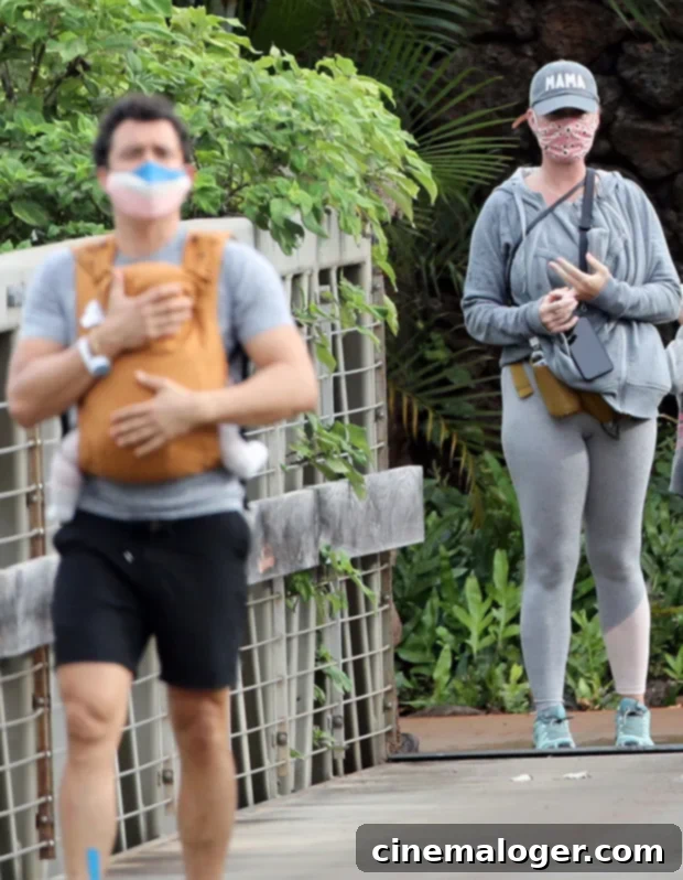 Island Parents: Katy Perry & Orlando Bloom's Relaxed Hawaii Stroll With Baby Daisy 2 Katy Perry in grey sweats with Orlando Bloom and baby Daisy in Hawaii