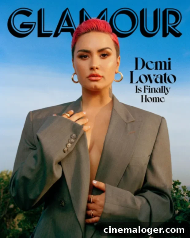 Demi Lovato with a new pixie cut, looking empowered in a glamorous photoshoot.