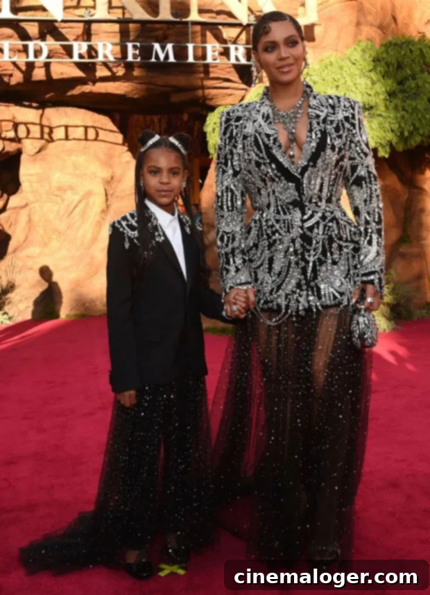 Historic Grammy Win For Blue Ivy Carter With Brown Skin Girl 3 Blue Ivy Carter holds hands with her mother Beyoncé on the red carpet for the premiere of Disney's The Lion King, showcasing their close bond.