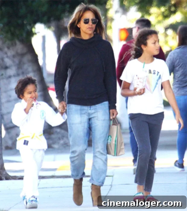 Halle Berry, a dedicated mother, navigating life with her children with a gentle smile.