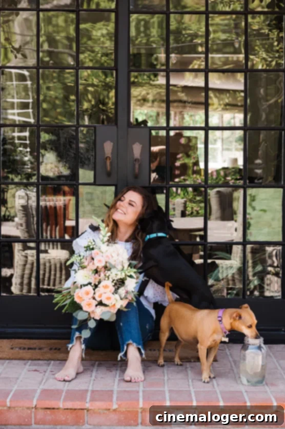 Tiffani Thiessen Reveals Her Single Request for Rob Dyrdek and Deliciousness Hosting Role 2 Tiffani Thiessen smiling brightly, looking elegant in a floral-patterned top.