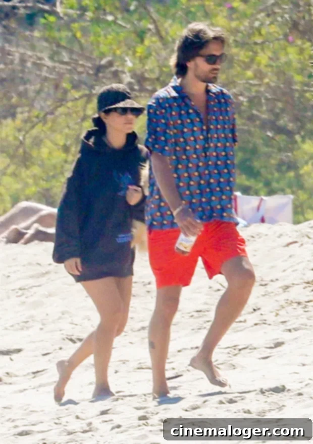 KUWTK Finale: Scott Disick Lets Go of Kourtney Dream 2 Scott Disick and Kourtney Kardashian walking together on a serene beach