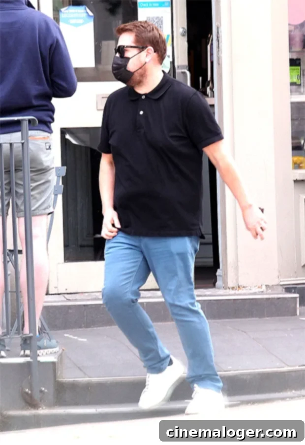James Corden Unveils Impressive 35-Pound Transformation In London 3 James Corden walking with his wife, Julia, while grabbing coffee in London