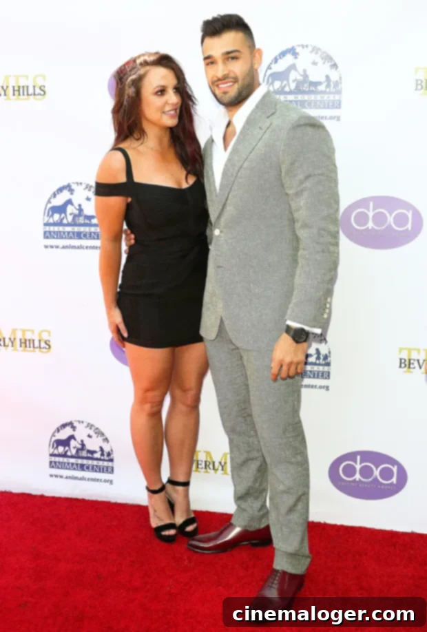 Britney Spears Gushes Over Sam Asghari's Powerhouse Gym Session 2 Britney Spears and her boyfriend, Sam Asghari, smiling together.
