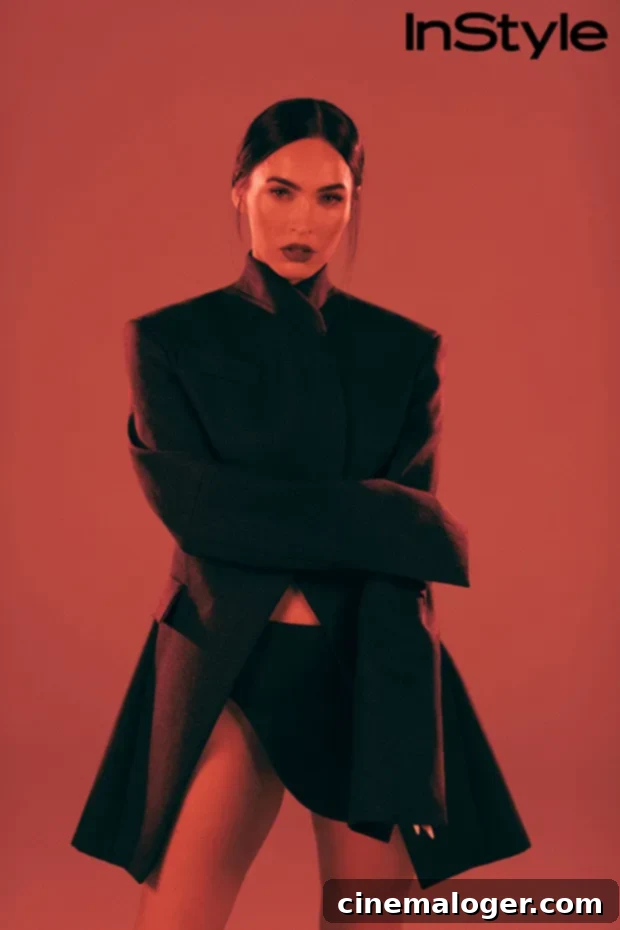 Megan Fox gazes intensely, showcasing her distinctive style and confident demeanor.