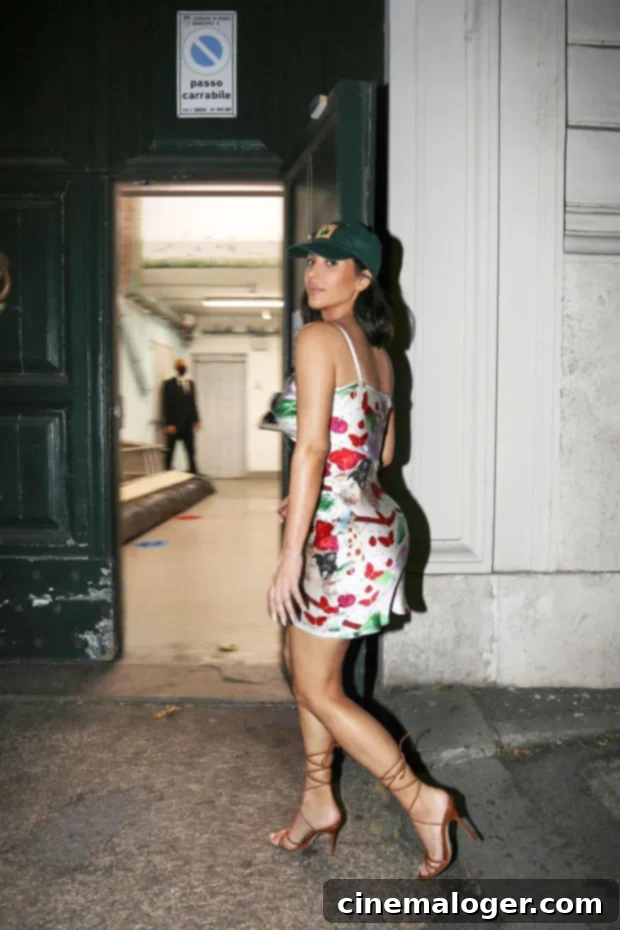 Kim Kardashian's Unexpected Style: Satin Mini, Stilettos & a Baseball Cap 3 Kim Kardashian's Roman outfit with Manolo Blahnik sandals and olive green hat