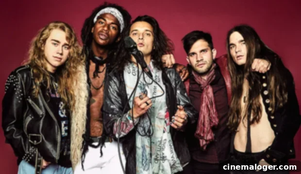 Classless Act Ignites 'Give It To Me,' Vows Rock Will Never Die 2 Classless Act band members, including vocalist Derek Day, guitarists Dane Pieper and Griffin Tucker, bassist Franco Gravante, and drummer Chuck McKissock, posing for a photo. They are captured in a stylish, somewhat gritty rock aesthetic, indicative of their music.