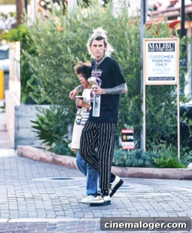 Machine Gun Kelly's Adorable Day Out With Daughter Casie, 12 2 Machine Gun Kelly with his daughter in Malibu, enjoying a casual outing.