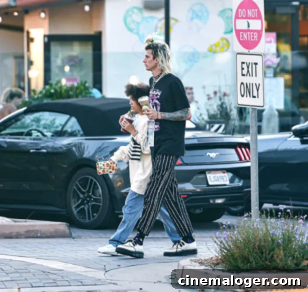 Machine Gun Kelly's Adorable Day Out With Daughter Casie, 12 3 MGK enjoying a smoothie with his teenage daughter, Casie Colson Baker.