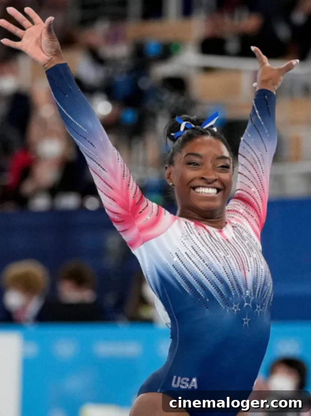 Simone Biles Stuns In Tie-Dye Bikini As She Unwinds Post-Olympics 2 Simone Biles finishes on the balance beam during the artistic gymnastics women’s apparatus final at the 2020 Summer Olympics