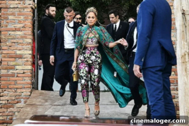 Jennifer Lopez's Royal Grandeur at D and G Venice 2 Jennifer Lopez looking like royalty in a green silk floral cape and tiara at the Dolce & Gabbana Alta Moda event in Venice