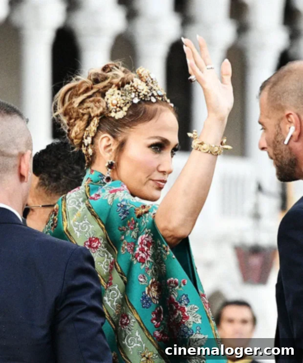 Jennifer Lopez's Royal Grandeur at D and G Venice 3 Jennifer Lopez waves to fans in Venice, Italy, showcasing her radiant beauty