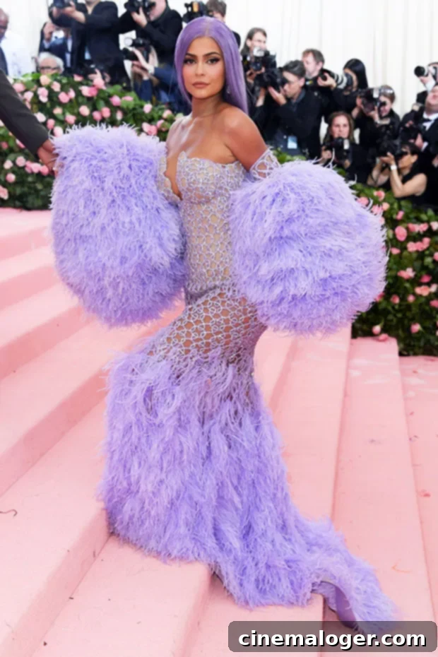 Pregnant Kylie Jenner Sits Out Met Gala, Revisits Iconic Looks 4 Kylie Jenner in Versace at the 2019 Met Gala, embodying the CAMP theme.