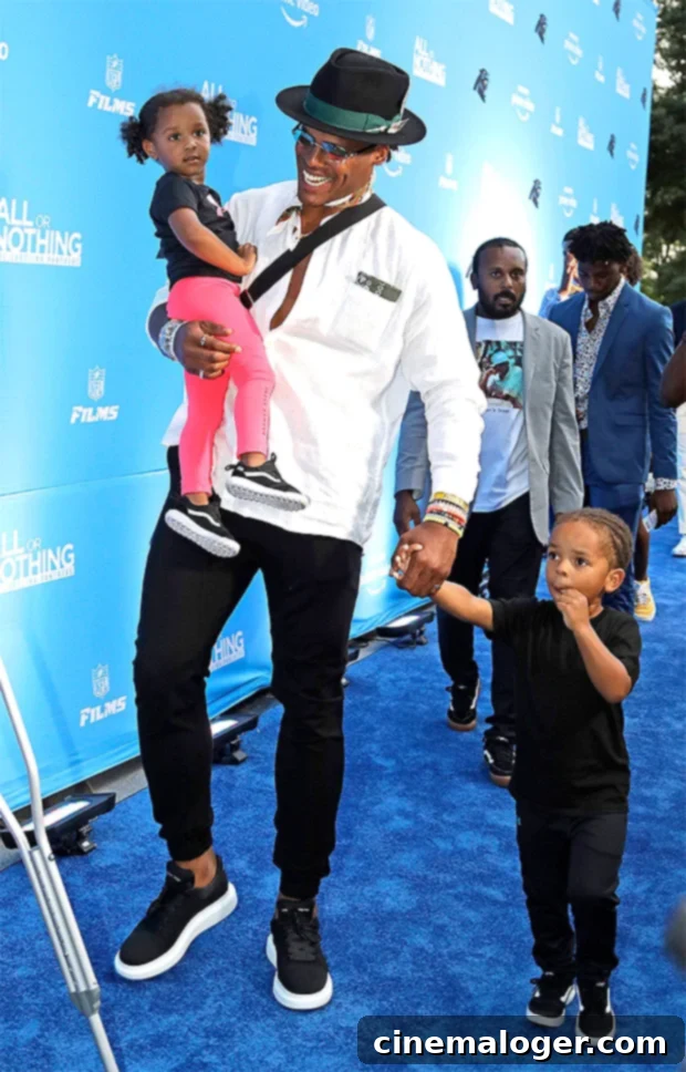 Cam Newton with his daughter Sovereign and son Chosen