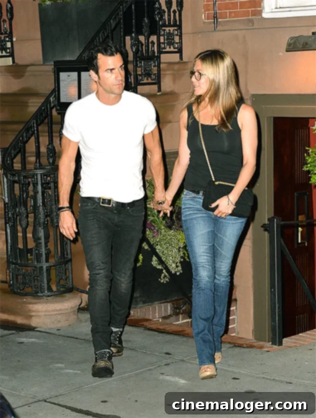 Jennifer Aniston Opens Up About Dating Again & Her Ideal Partner 2 Jennifer Aniston and Justin Theroux sharing a moment during an outing in 2013, illustrating their past relationship.