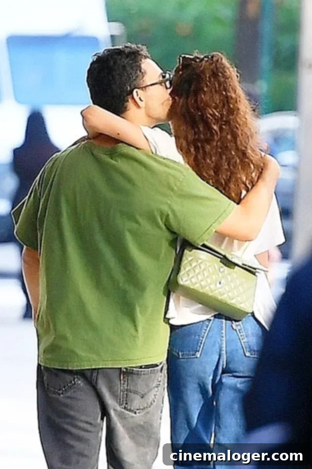 Jack Antonoff & Margaret Qualley's PDA-Packed NYC Romance 3 Jack Antonoff and Margaret Qualley smiling and walking together in New York City.