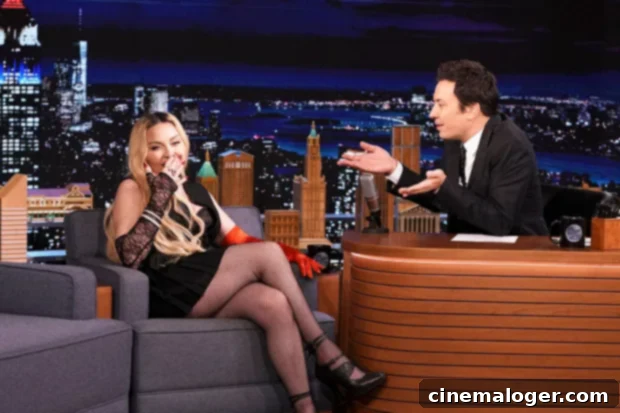 Madonna Leaps Fallon's Desk, Unleashes Wild Dress-Lifting Dance on 'Tonight Show' 2 Madonna interacting with Jimmy Fallon on The Tonight Show