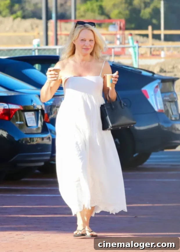 Pamela Anderson, 54, Stuns Makeup-Free in White Dress During Malibu Coffee Run 2 pamela anderson