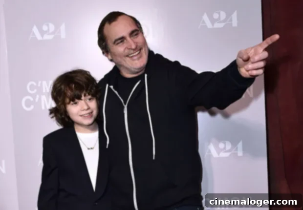 Joaquin Phoenix's Heartwarming Bond With 11-Year-Old Co-Star Nephew At Screening 2 Joaquin Phoenix pointing something out to young co-star Woody Norman at the 'C'mon C'mon' movie screening