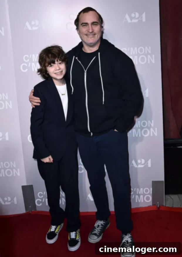 Joaquin Phoenix's Heartwarming Bond With 11-Year-Old Co-Star Nephew At Screening 3 Joaquin Phoenix and Woody Norman posing closely and smiling at the 'C'mon C'mon' movie screening