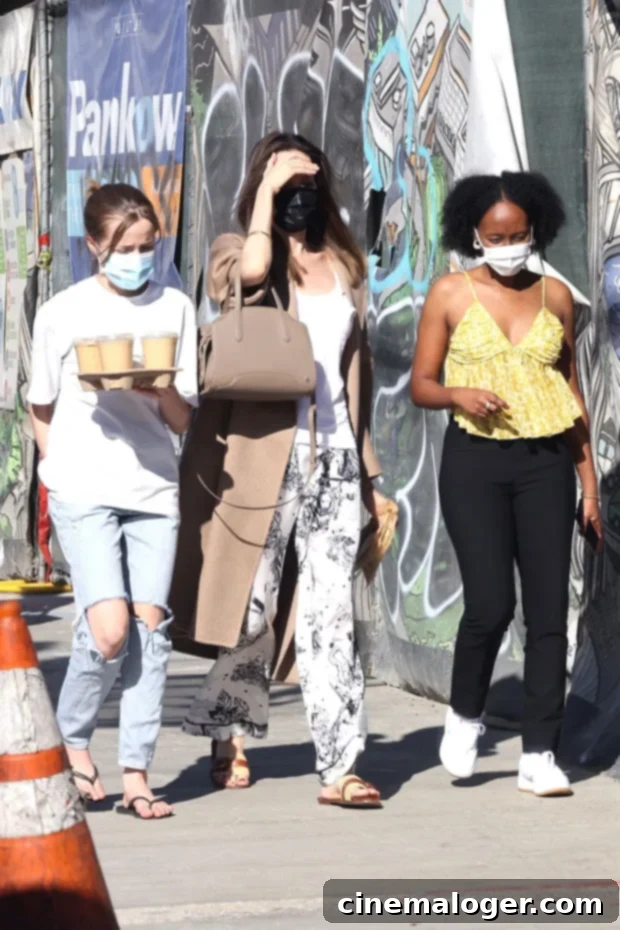 Angelina Jolie and her daughters Vivienne and Zahara enjoying a coffee outing in Los Feliz, showcasing their relaxed family style.