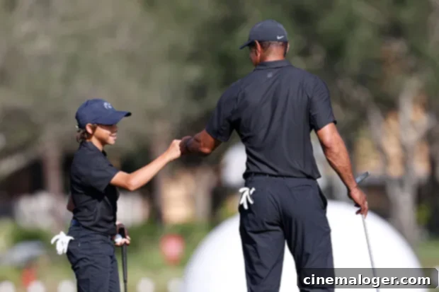 Tiger Woods and his son Charlie Woods smiling during the PNC Championship.