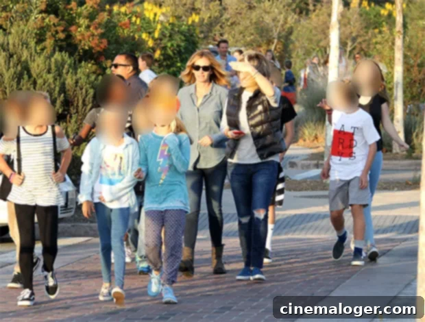 Ageless Julia Roberts, 54, Glows In Floral Blouse On Family Day 3 Julia Roberts walking hand-in-hand with her children Phinnaeus, Hazel, and Henry at the Malibu Town Carnival Fair.
