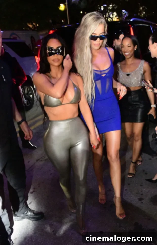 Kim's Metallic & Khloe's Blue Make Waves at SKIMS Swim Party 2 Kim and Khloe Kardashian arriving at the SKIMS Swim pop-up in Miami, showcasing their launch night style.