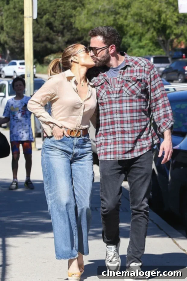 Jennifer Lopez and Ben Affleck's Steamy School Drop-Off Kiss 2 Ben Affleck and J.Lo share a tender kiss as they pick up Samuel from school, displaying their affection publicly.