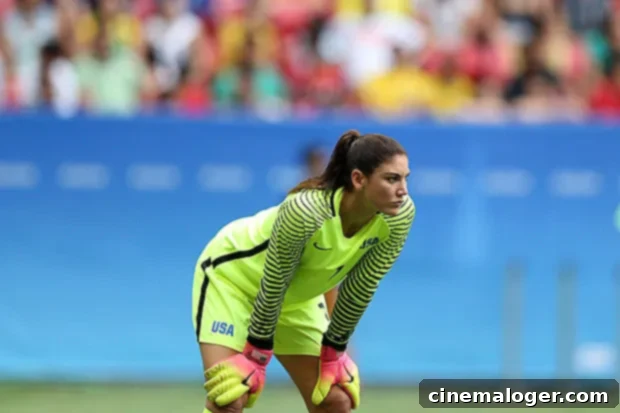 Hope Solo Arrested For Endangering Children In Alleged DUI 2 Hope Solo walking, looking ahead, wearing a coat.