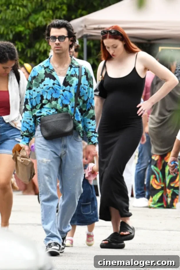 Sophie Turner's Baby Bump Bliss: A Tender Outing with Joe Jonas 2 Sophie Turner and Joe Jonas at a farmer's market, Sophie showing her baby bump.