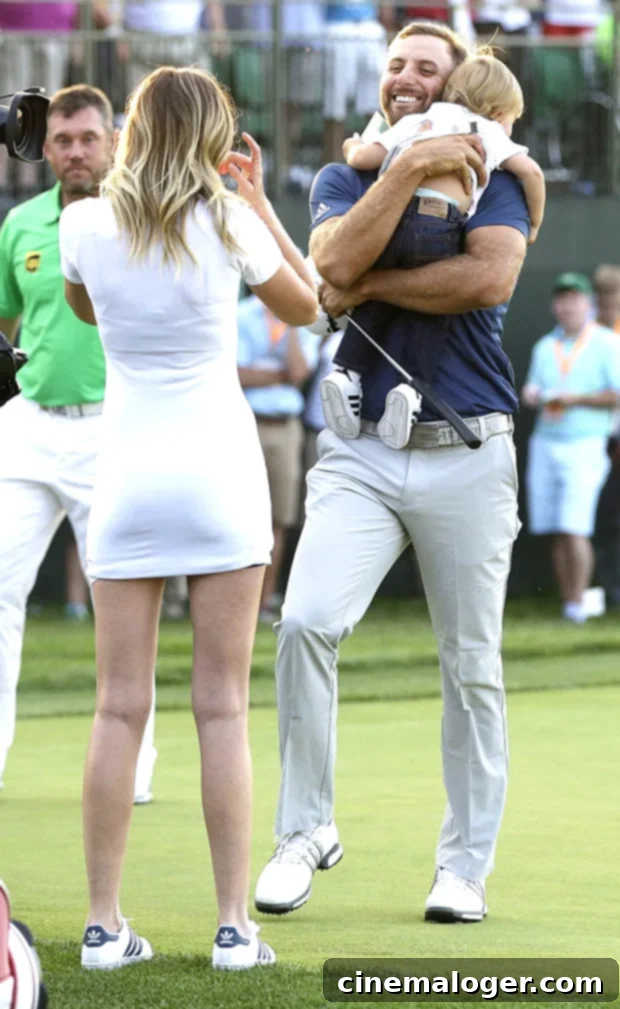 Paulina Gretzky and Dustin Johnson's Journey to Marriage: A Complete Relationship Timeline 3 Tatum Gretzky Johnson, a young boy, joyfully hugs his daddy Dustin Johnson on the 18th hole after Dustin won the 2016 U.S. Open golf championship.