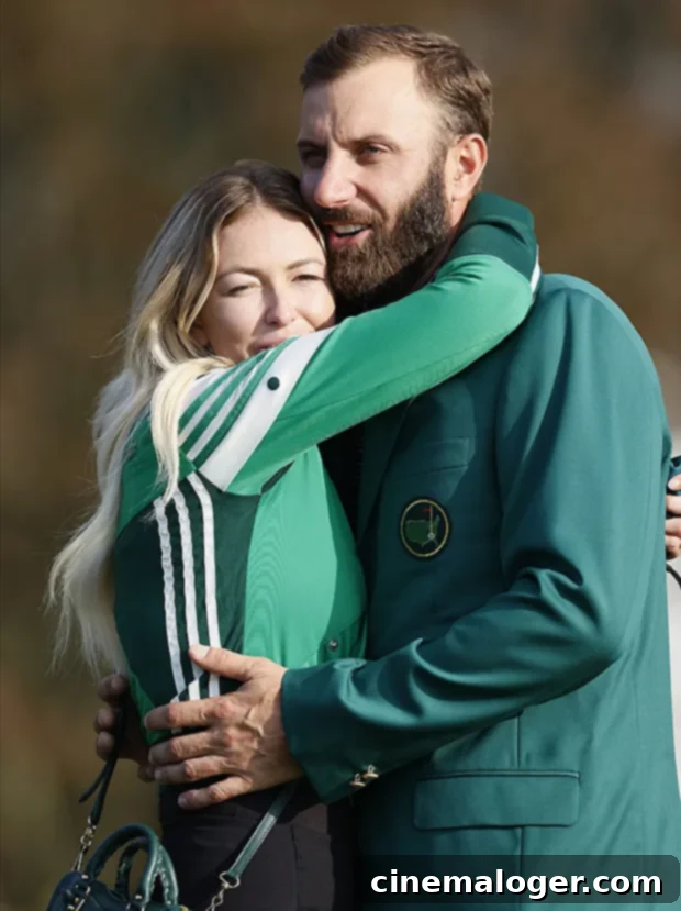 Paulina Gretzky and Dustin Johnson's Journey to Marriage: A Complete Relationship Timeline 5 Paulina Gretzky lovingly hugs Dustin Johnson who is wearing a green jacket after winning the 2020 Masters Tournament at Augusta National Golf Club.