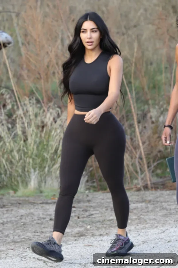 Kim K Trainer's Top Tips for Weight Loss: Cook More, Change Little 2 Kim Kardashian on a hike, embodying a healthy and active lifestyle championed by her trainer Melissa Alcantara.