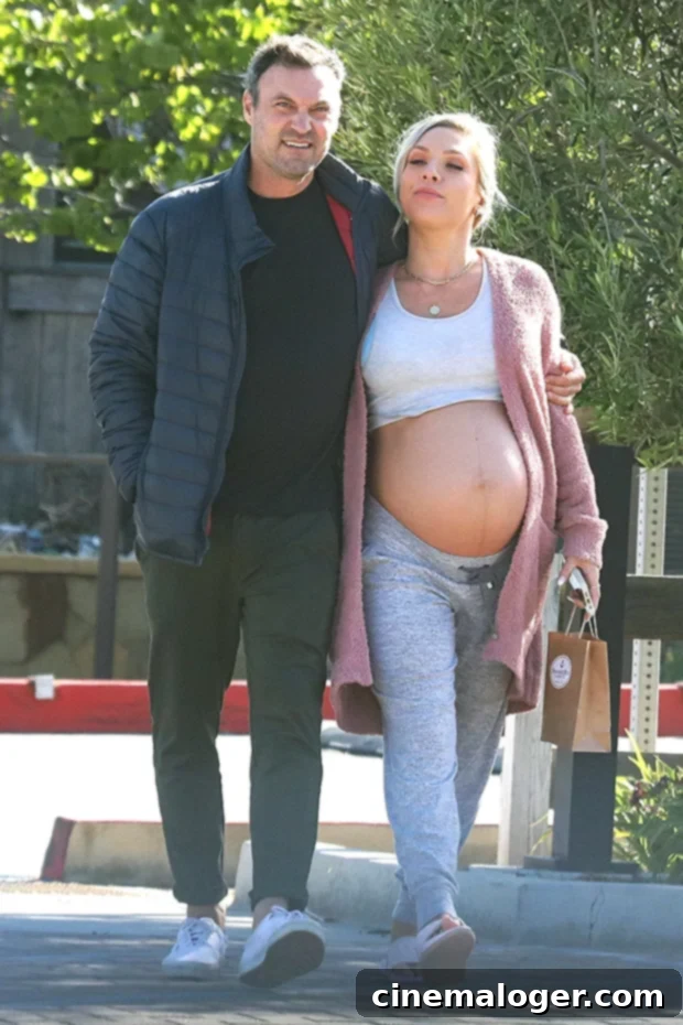 Sharna Burgess Rocks Crop Top, Bares Baby Bump on Outing With Brian Austin Green 2 Brian Austin Green & Sharna Burgess sharing a tender moment, with Sharna's prominent baby bump visible, during their Malibu outing.