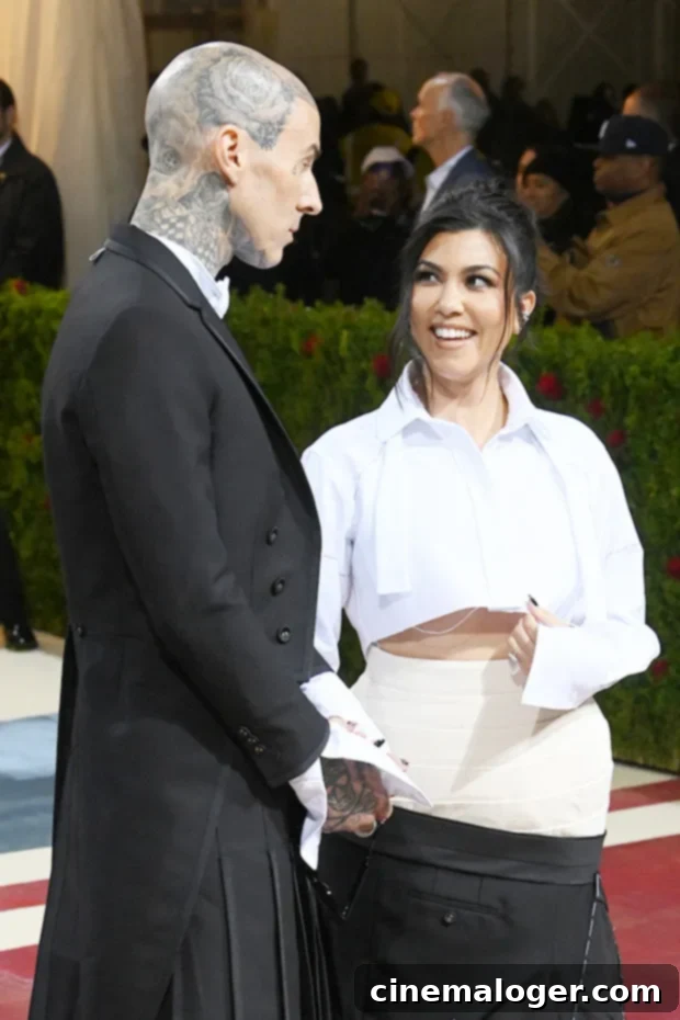 Kourtney Kardashian Flaunts Sheer White Top, Holds Hands With Travis Barker on Honeymoon 3 kourtney kardashian travis barker
