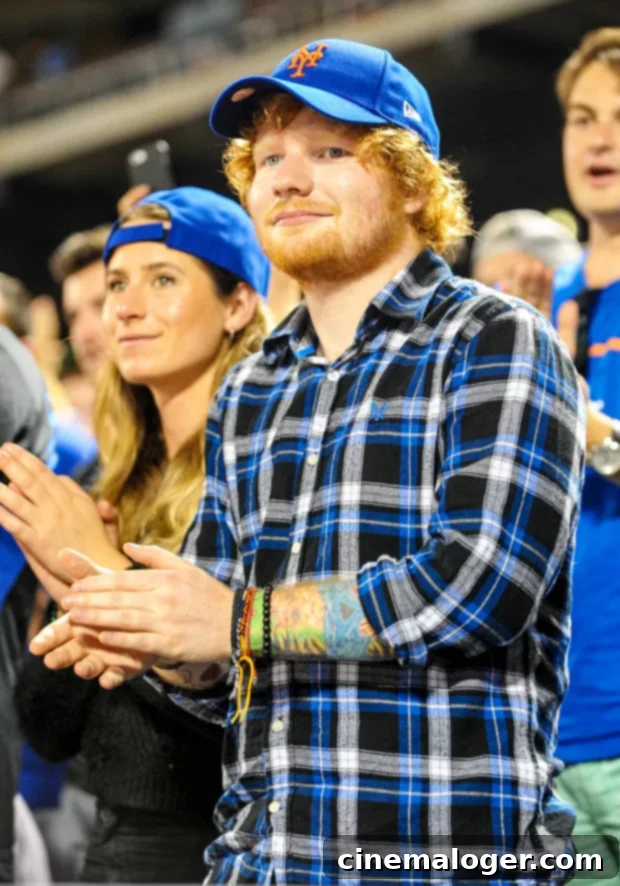 Ed Sheeran and Cherry Seaborn with their two daughters enjoying a sunny day in a London park.