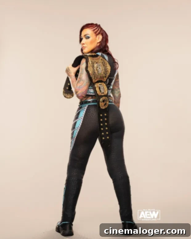 Mercedes Martinez'den Gurur Sesleri: Kendi Gerçek Benliğini Yaşa 3 Mercedes Martinez posing confidently with her championship belt.