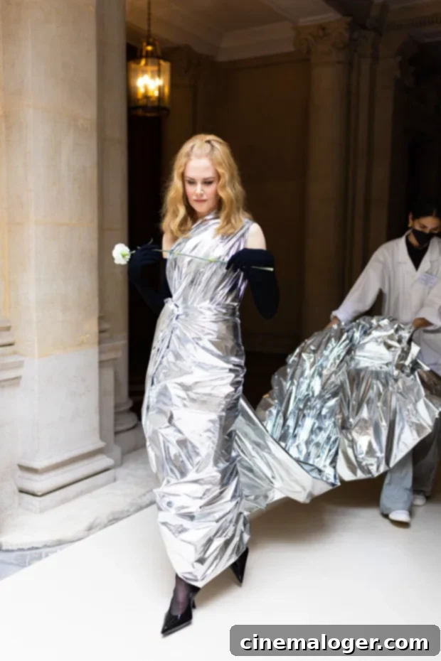 Nicole Kidman's Balenciaga Silver Stunner 2 Nicole Kidman captivates in a metallic silver Balenciaga gown during her runway debut at Paris Fashion Week Fall 2022 Couture.