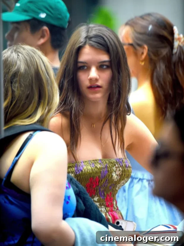 Suri Cruise, 16, Is Katie Holmes' Twin In Stunning Off-Shoulder Dress Pictures 3 Suri Cruise resembling Katie Holmes during an outing with a friend