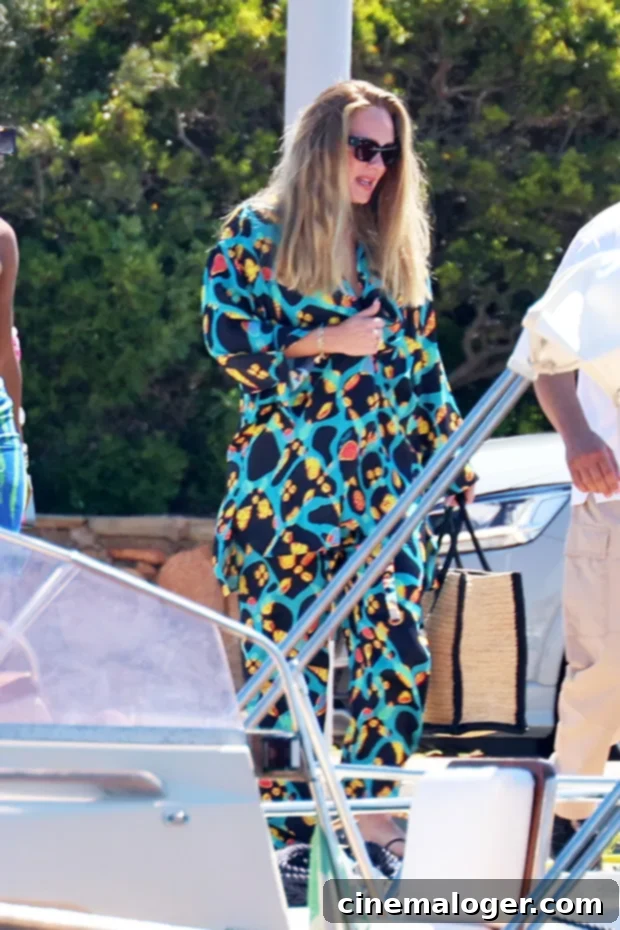 Adele Rocks Vibrant Beach Look in Sardinia Alongside Rich Paul 3 Adele in colorful outfit on a boat