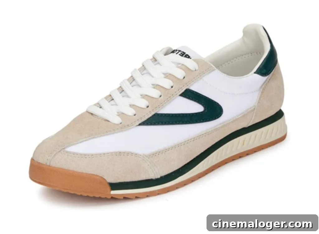 A white/green Tretorn sneaker.
