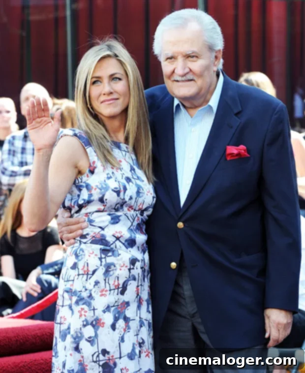Jennifer Aniston Remembers Father John, 89, with Enduring Love 4 Jennifer Aniston and her father John Aniston smile for the camera at a red carpet event.
