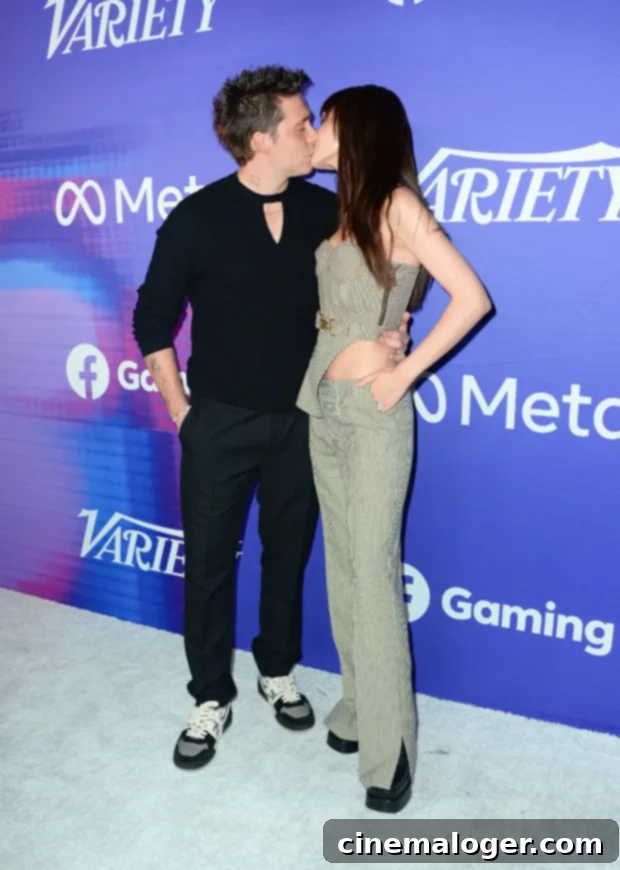 Nicola Peltz Debuts Bold Dark Hair With Red Carpet PDA 2 Brooklyn Beckham and Nicola Peltz Beckham kissing on red carpet