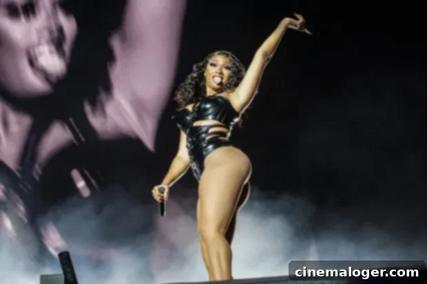 Megan Thee Stallion Dazzles in Rainbow Cutout Jumpsuit, Embracing Her True Figure 2 Megan Thee Stallion