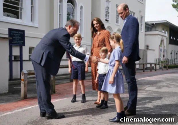 Cambridge Children George, Charlotte, Louis Make School Day Debut in New Photos 3 Headmaster Jonathan Perry welcoming Princes George and Louis and Princess Charlotte to Lambrook School