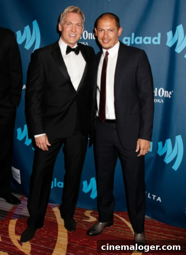 Sam Champion and Rubem Robierb attending the GLAAD Media Awards in 2013, dressed formally and posing for cameras.